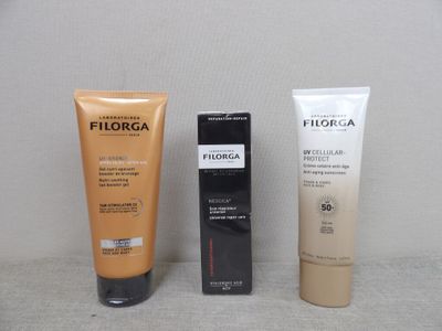 deux tubes de Filorga et un tube de Filorga posés sur une table