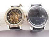 two watches that are sitting next to each other