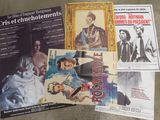 a lot of different movie posters on the floor