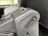 a suitcase sitting in the back seat of a truck