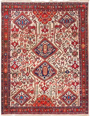 un ancien tapis persan à motifs rouges et bleus