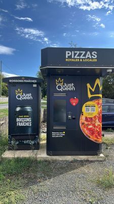 two vending machines that have pizzas on them