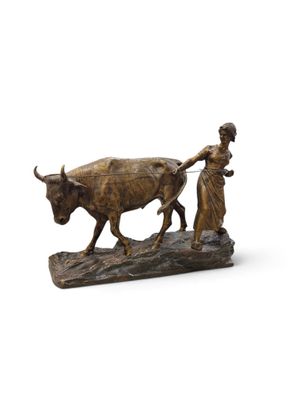 statue représentant une femme tirant un taureau, tandis qu'un homme est assis sur une charrue