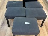 four stools and a small table in a store