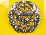 a close up of a yellow plate with a crown on it