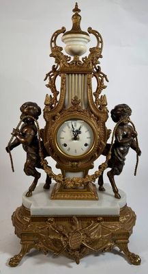 a clock that is sitting on top of a marble base