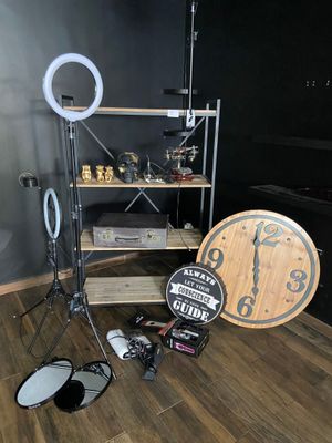 a photo of a room with a clock, a camera, and other items