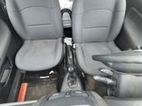 two gray seats in the back of a car