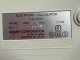 an electronic calculator with a sharp corporation label on it