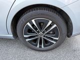 a close up view of a car ' s tire on the road