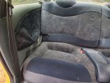 a seat in the back of a car that is dirty