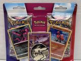 three packs of pokemon trading cards are in a package