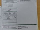 une photo d'un ticket de caisse et d'un stylo posés sur une table