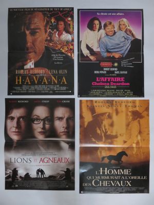four movie posters of various movies are displayed on a wall