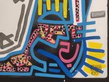 graffiti painting of a woman ' s face with a hat and boots