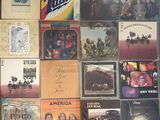 a lot of albums and cds on the wall