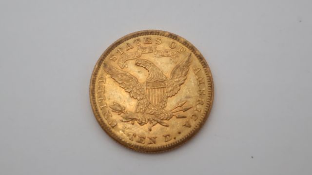 Une pièce de monnaie en or à valeur faciale de dix dollars USA Li...