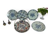 a lot of plates that are sitting on a table