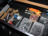 a drawer full of assorted items in a car