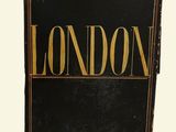 a black and gold chest with the word london written on it