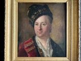 portrait of a young man in a red coat and a black hat