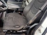 a dirty seat in the back of a car