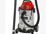 un aspirateur rouge et argenté muni d'une poignée noire
