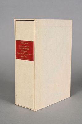 a white box with a red label sitting on top of a gray surface