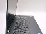 a laptop that is open on a white surface