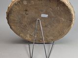 a large piece of wood sitting on a metal stand