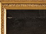 an image of a gold framed mirror with a black background