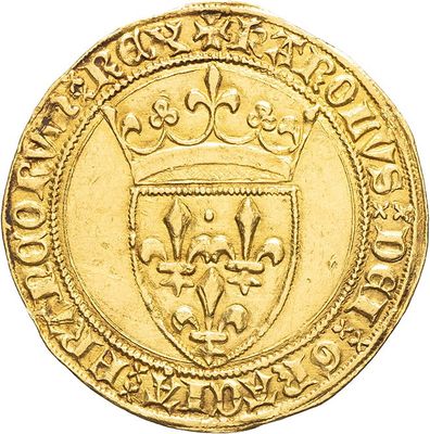a close up of a gold coin with a crown on it