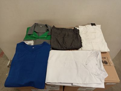 a pile of clothing sitting on top of a cardboard box