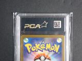 a close up of a pokemon card in a plastic case
