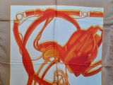 an orange and white scarf with a picture of a bicycle on it