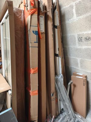 a pile of boxes and other items in a room