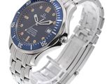 a close up of a wrist watch with a blue dial
