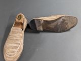 a close up of a pair of shoes on a table
