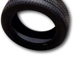 a close up of a tire on a white background with a red dot
