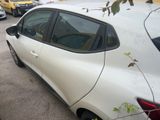a white car that is parked on the side of the street