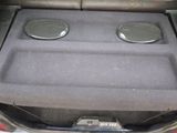 two speakers in the trunk of a car