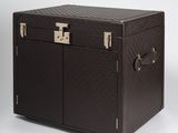 an image of a brown trunk with two doors and a handle