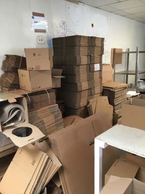 a room with a lot of boxes and boxes on the floor