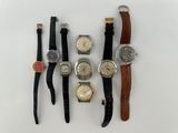 several different types of watches are displayed on a white surface
