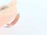 a pink ring with a silver band on top of it