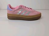 a pink adidas sneakers on a white background