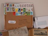a pile of mail and stamps sitting on a table