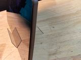 a laptop computer sitting on top of a wooden table