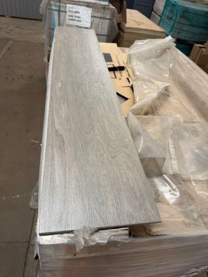 several pieces of wood sitting on top of a table in a warehouse