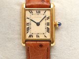 a close up of a wrist watch with roman numerals on it